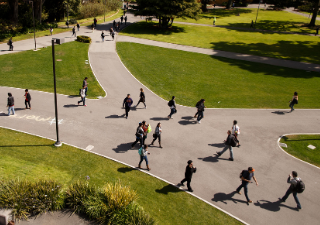 Ariel of campus with a path with students walking