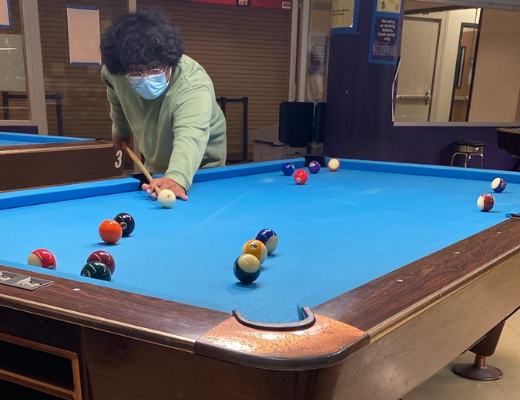 SFSU student playing pool