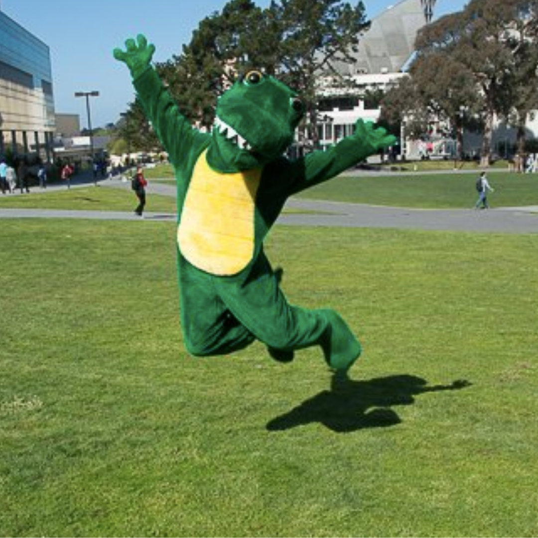 SFSU's Ali the gator jumping on the grass on the quad