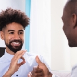 Two men using American Sign Language