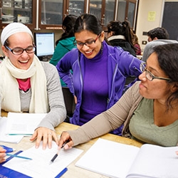 SFSU Students working on a project assignment around a table